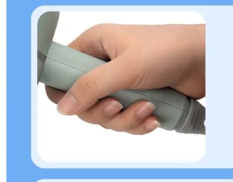 Hand holding a gray electronic device against a blue background